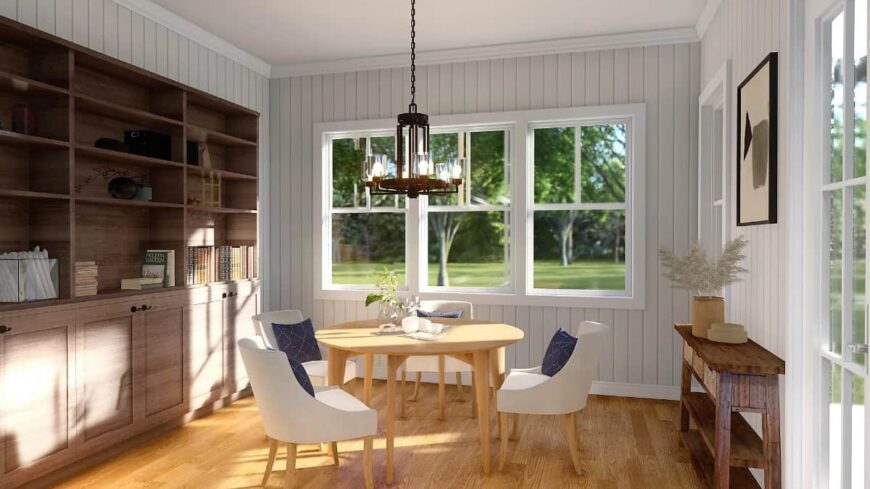 Breakfast room with a round dining set, a large cabinet, and a wooden buffet table.