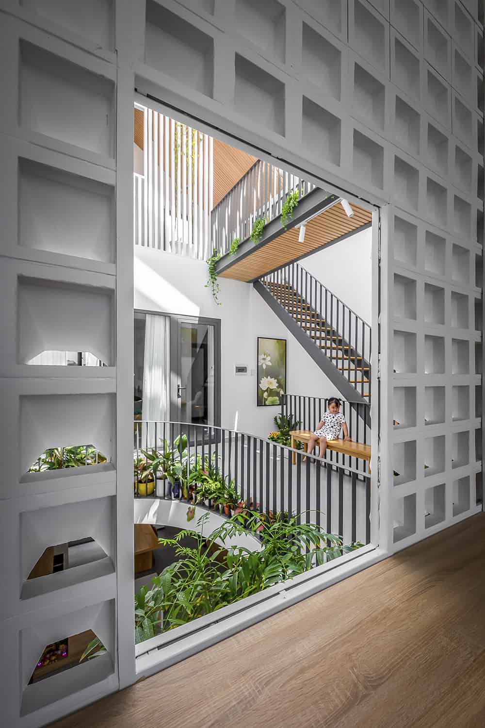 A large window overlooks the atrium and balconies.