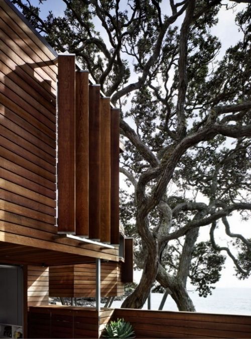 A focus shot of the exterior cladding design, featuring an outer rain screen of cedar boards that protects the weatherskin and reduces solar gain through the walls.