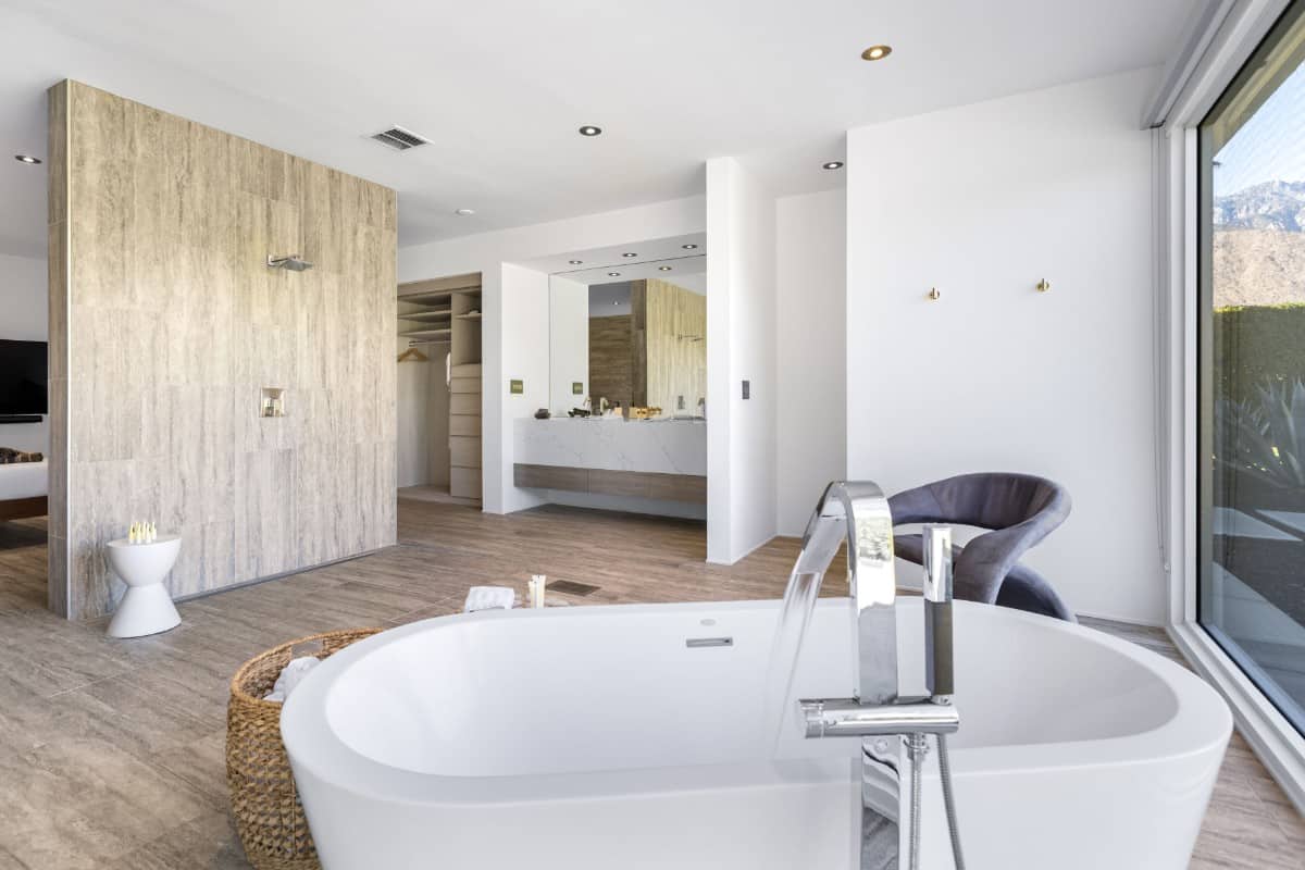 The primary bathroom includes a deep soaking tub with chrome fixtures.