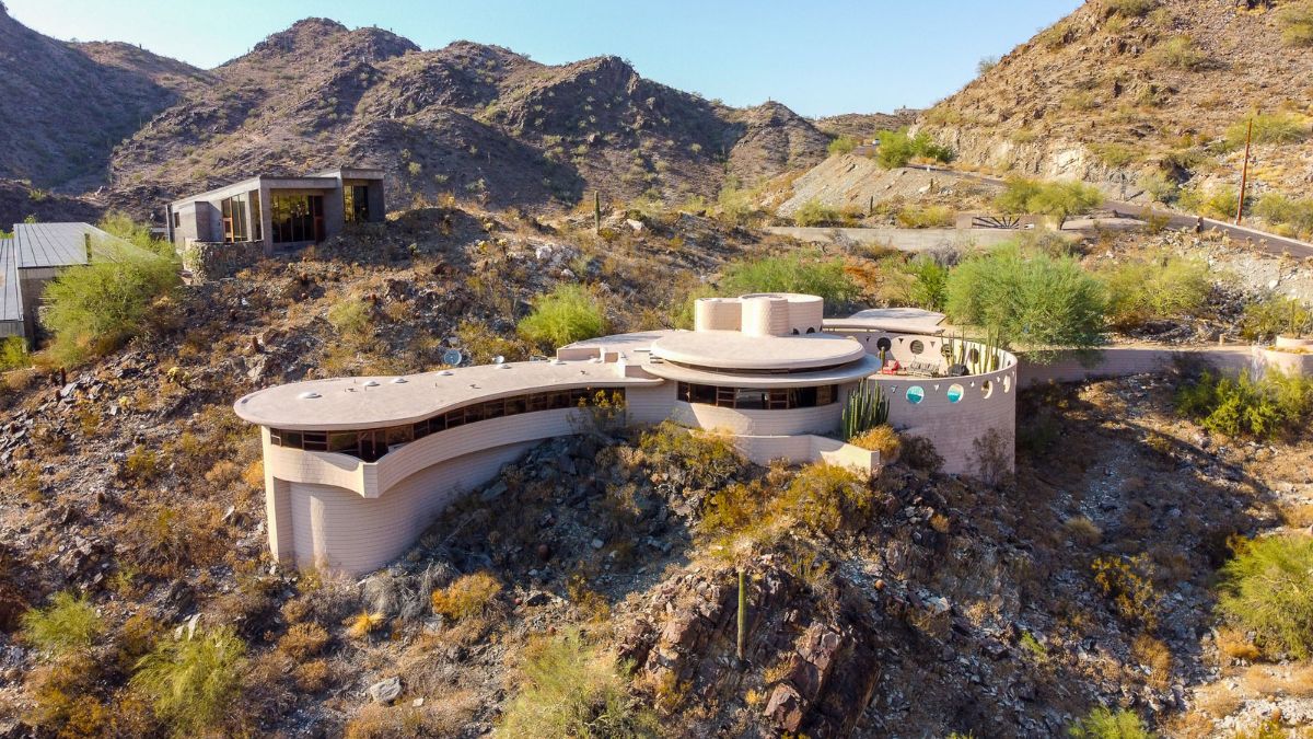 A breathtaking full picture of the mansion on a mountain scenery, it was well structured, and the architecture complements the location where the house was built.