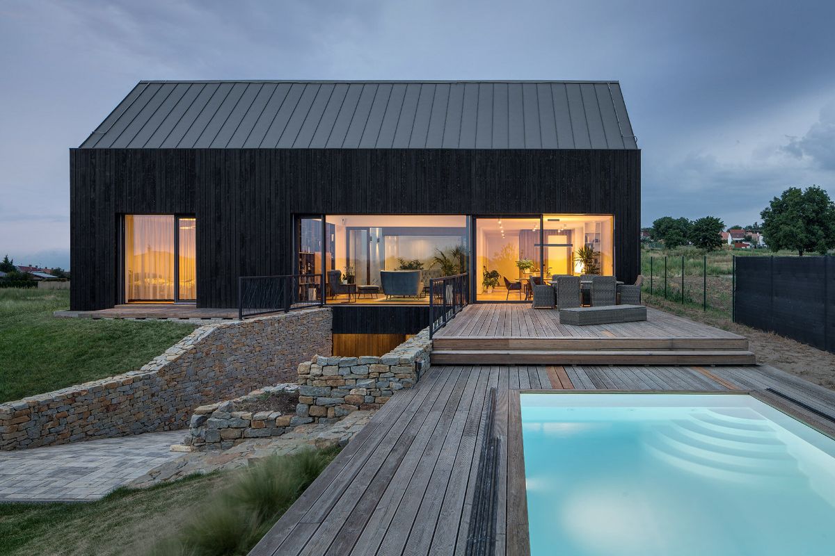 The pool area on the wooden deck near the patio.