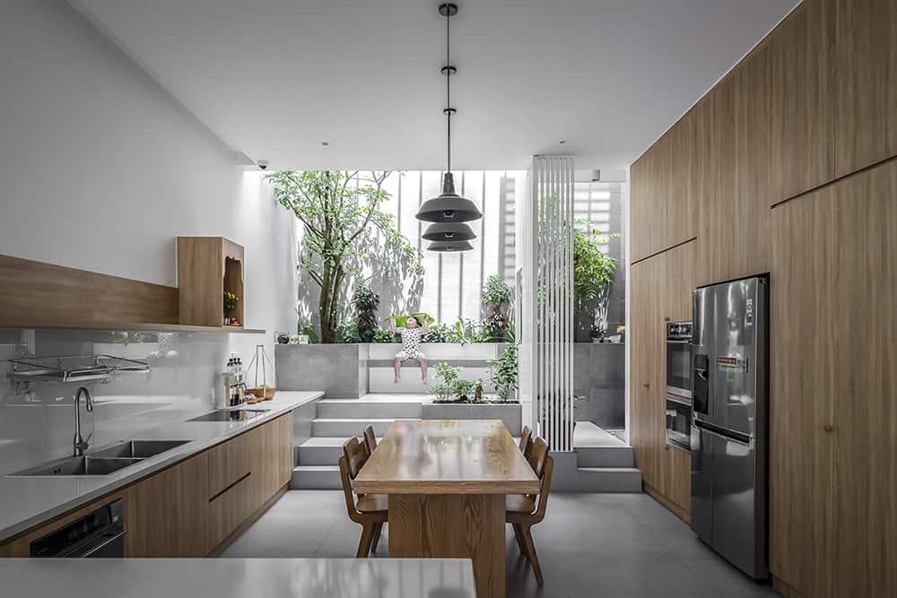 The eat-in kitchen is accompanied by a lovely atrium.