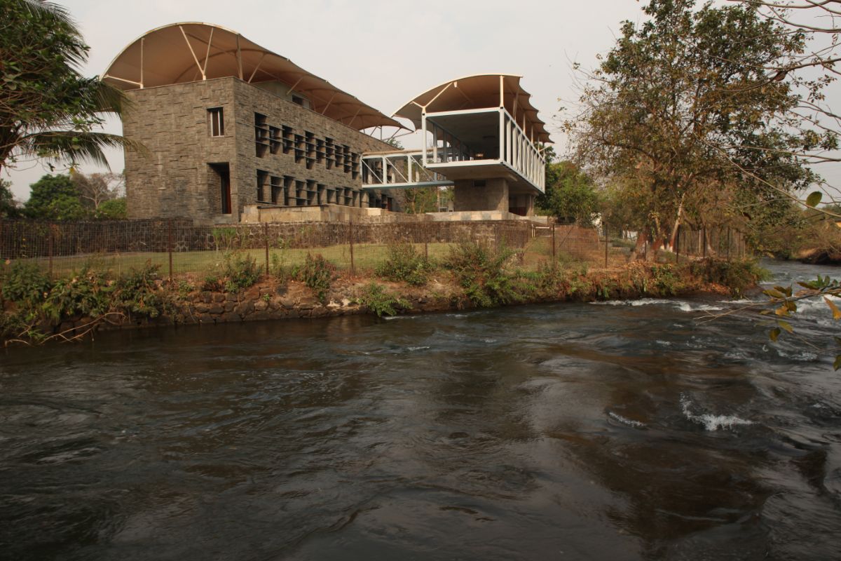 This view features the river, veranda, and main building.