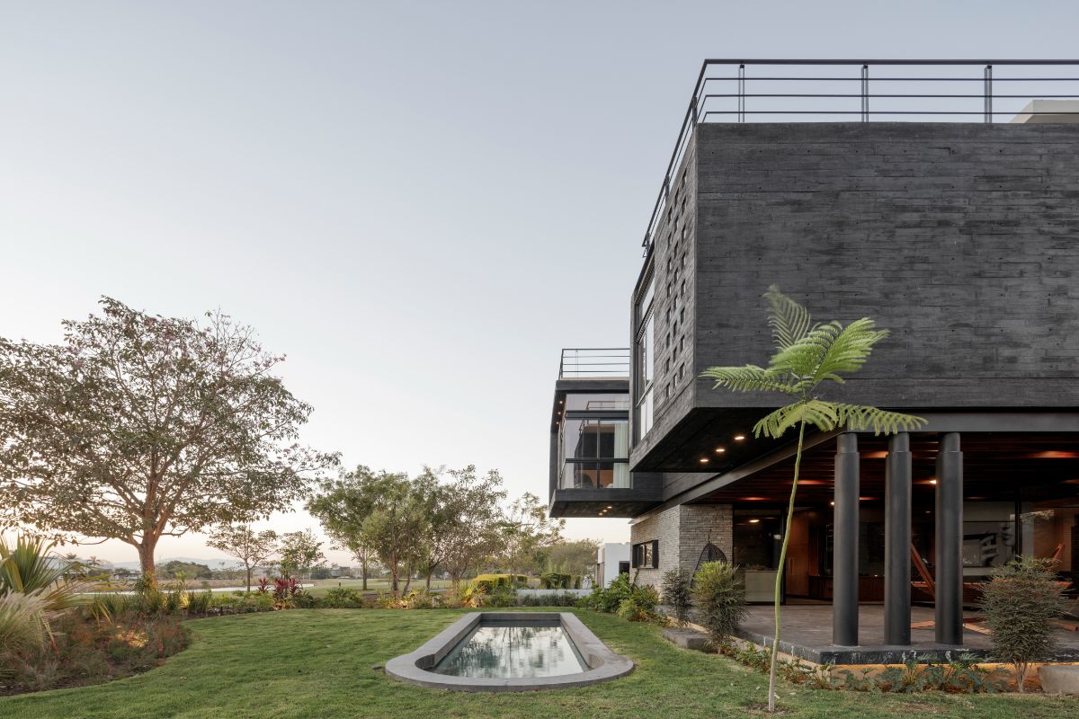 The house features a pool in front of the living area.