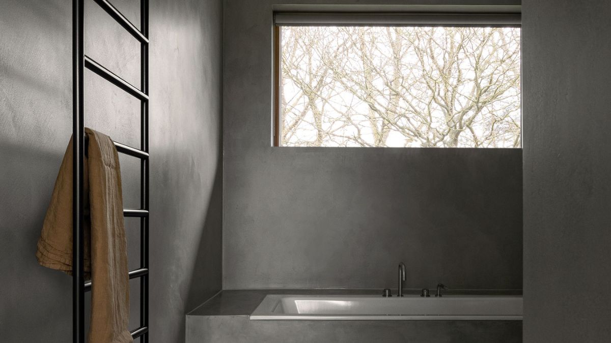 Darker colors have been used in the restrooms to create a sense of a sense of sanctuary and a sense of isolation.