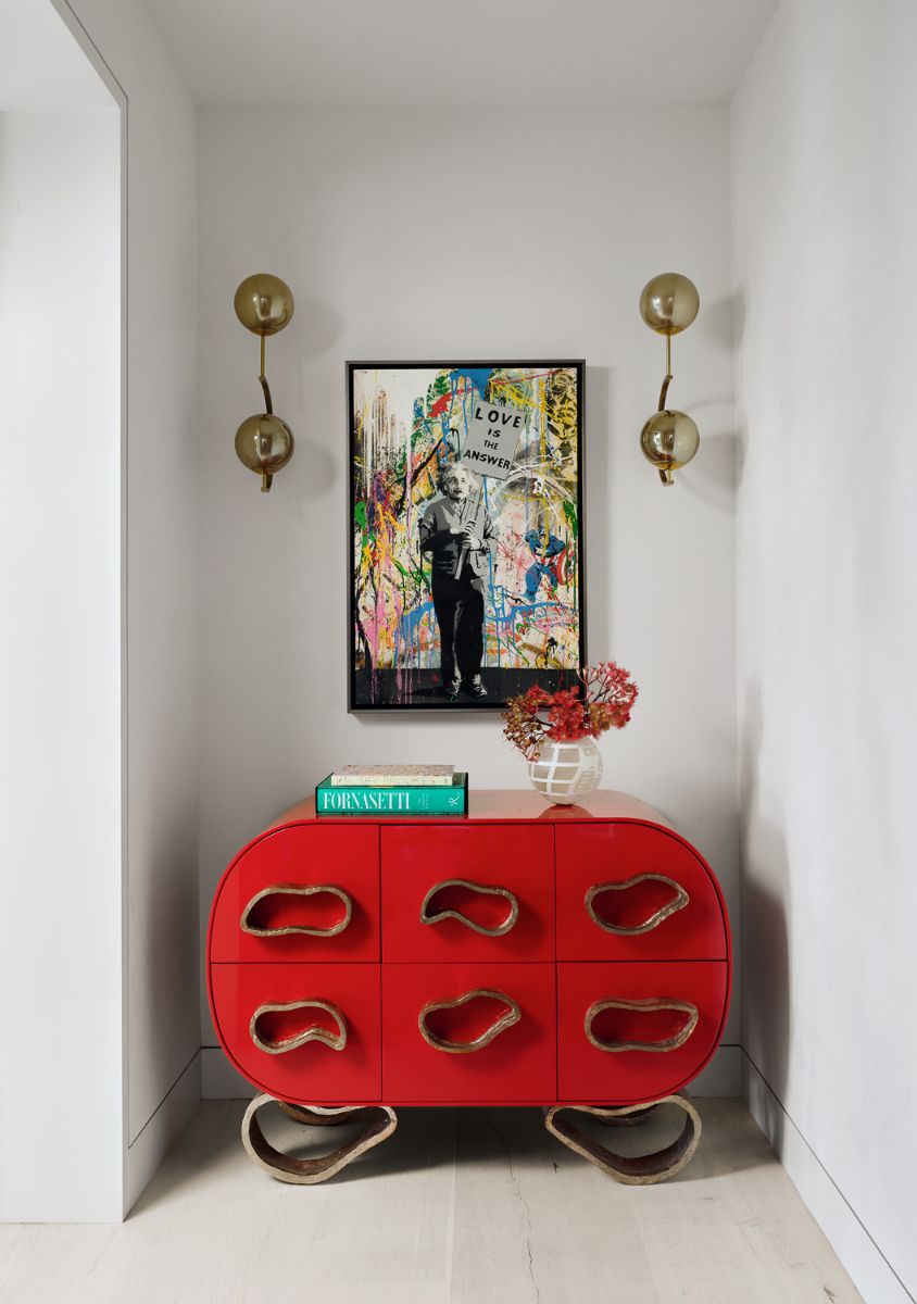 A customized entryway table adorned with artwork.