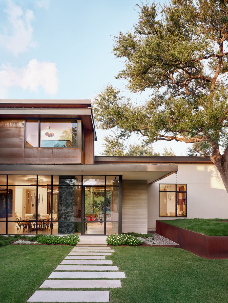 The large expanses of glass that make the home transparent from front to back upon entry, allowing for incredible vistas throughout.