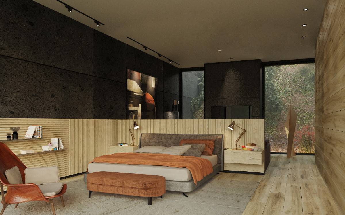 This bedroom features a mixture of concrete, glass, and wood panels. It includes a sitting area warmed by a fireplace.