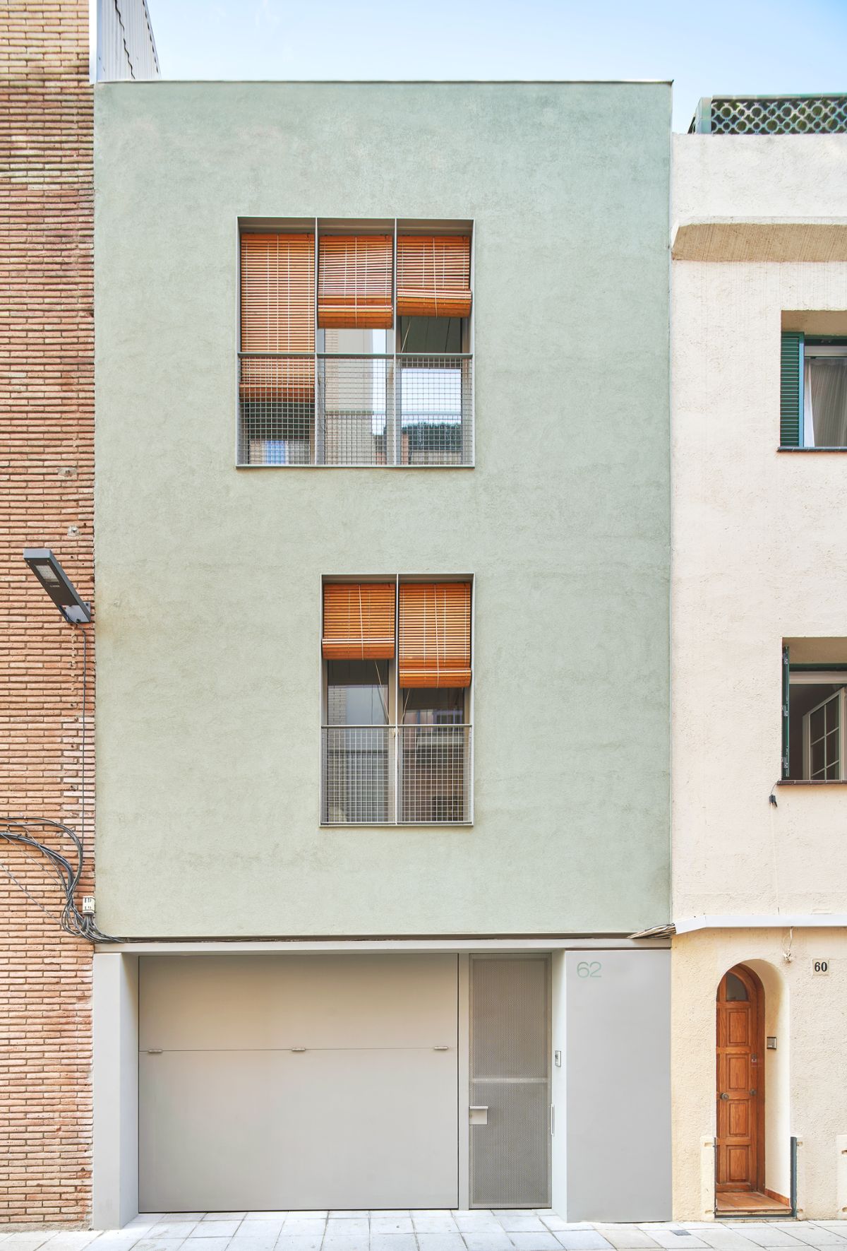 The exterior of the house shows the concrete pavement and the terraces.