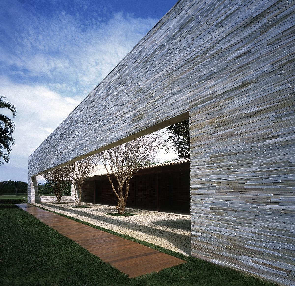 The exterior of the house is faced with stone.