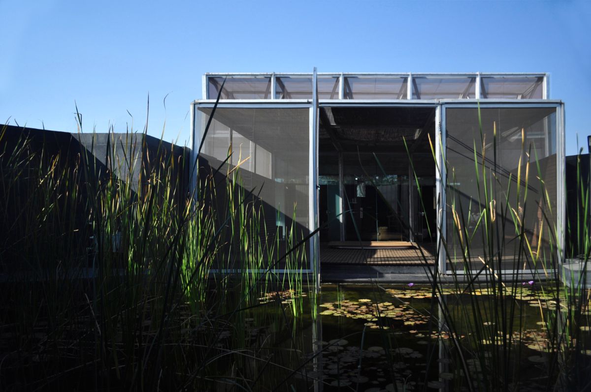 At the entrance, there is a lily pond that creates a harmonious relationship between nature and man-made structures.