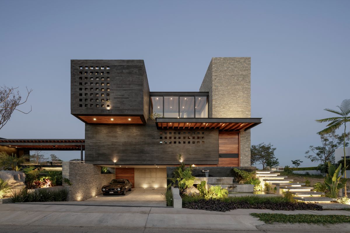 Volcanic stones are used as the exterior of the house, and the black color of the stone is a gesture of respect to the volcano surrounding the area.