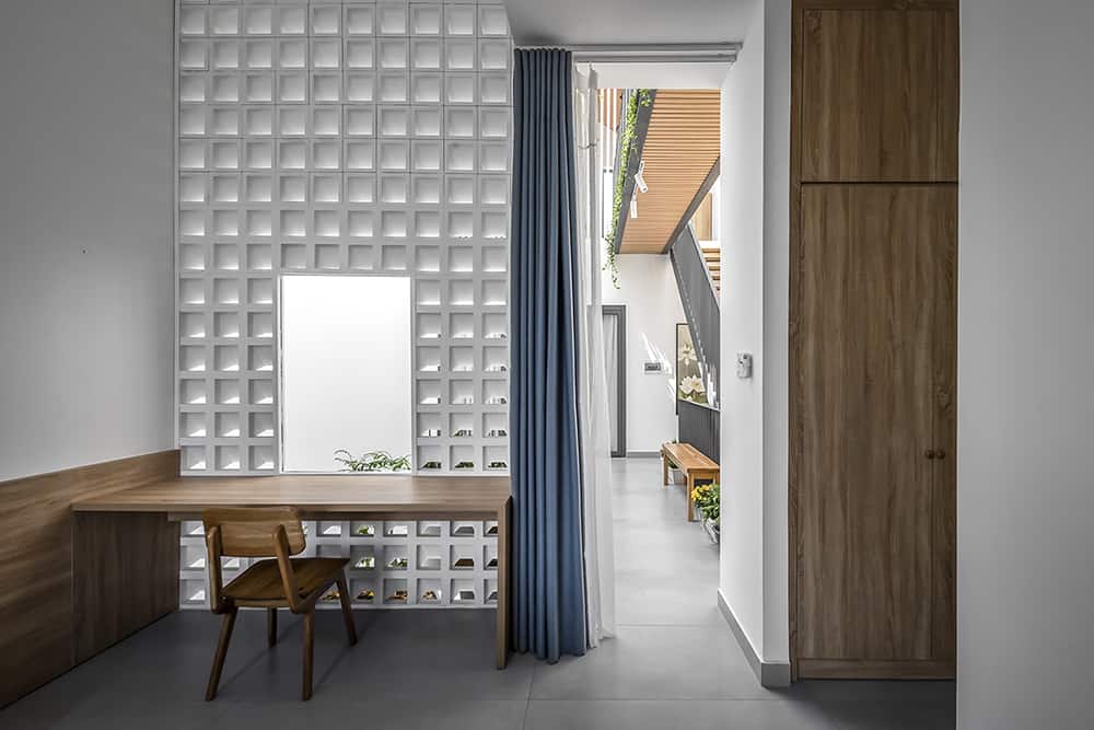 The second bedroom includes a built-in desk that doubles as a vanity area.