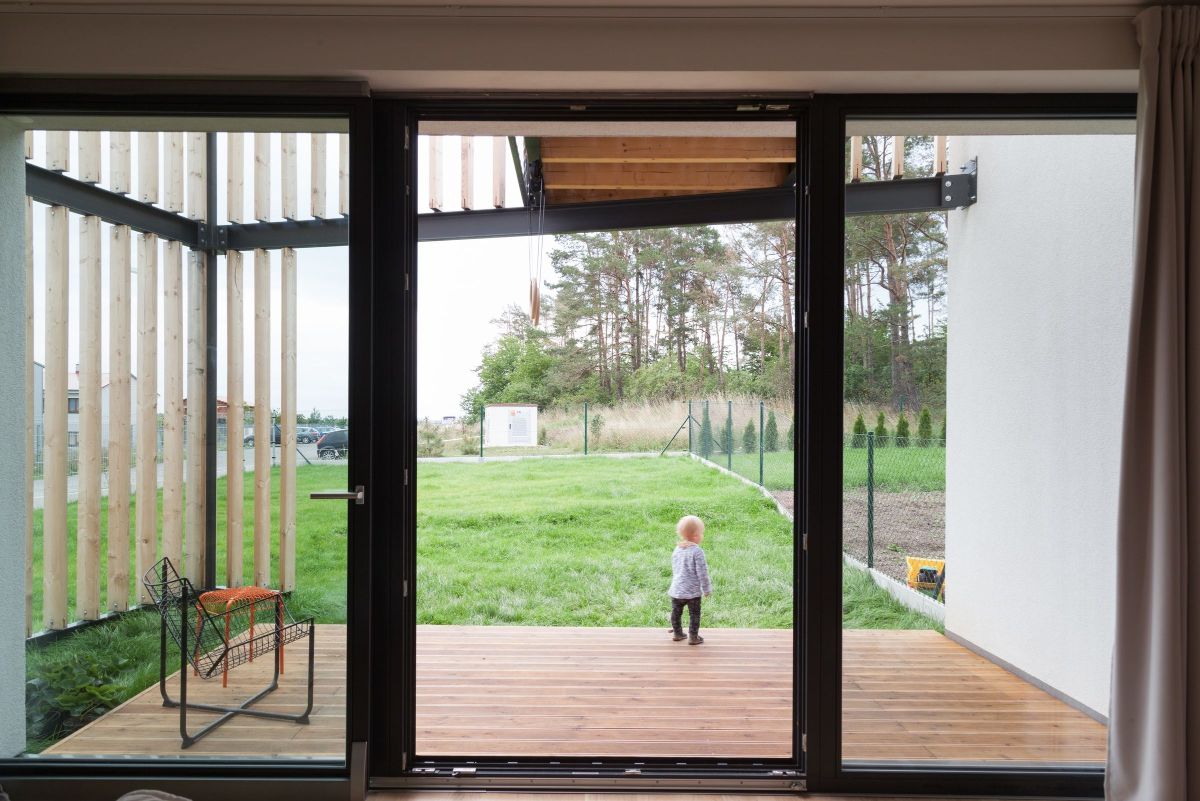 The back exit door with a balcony and views of the landscape.