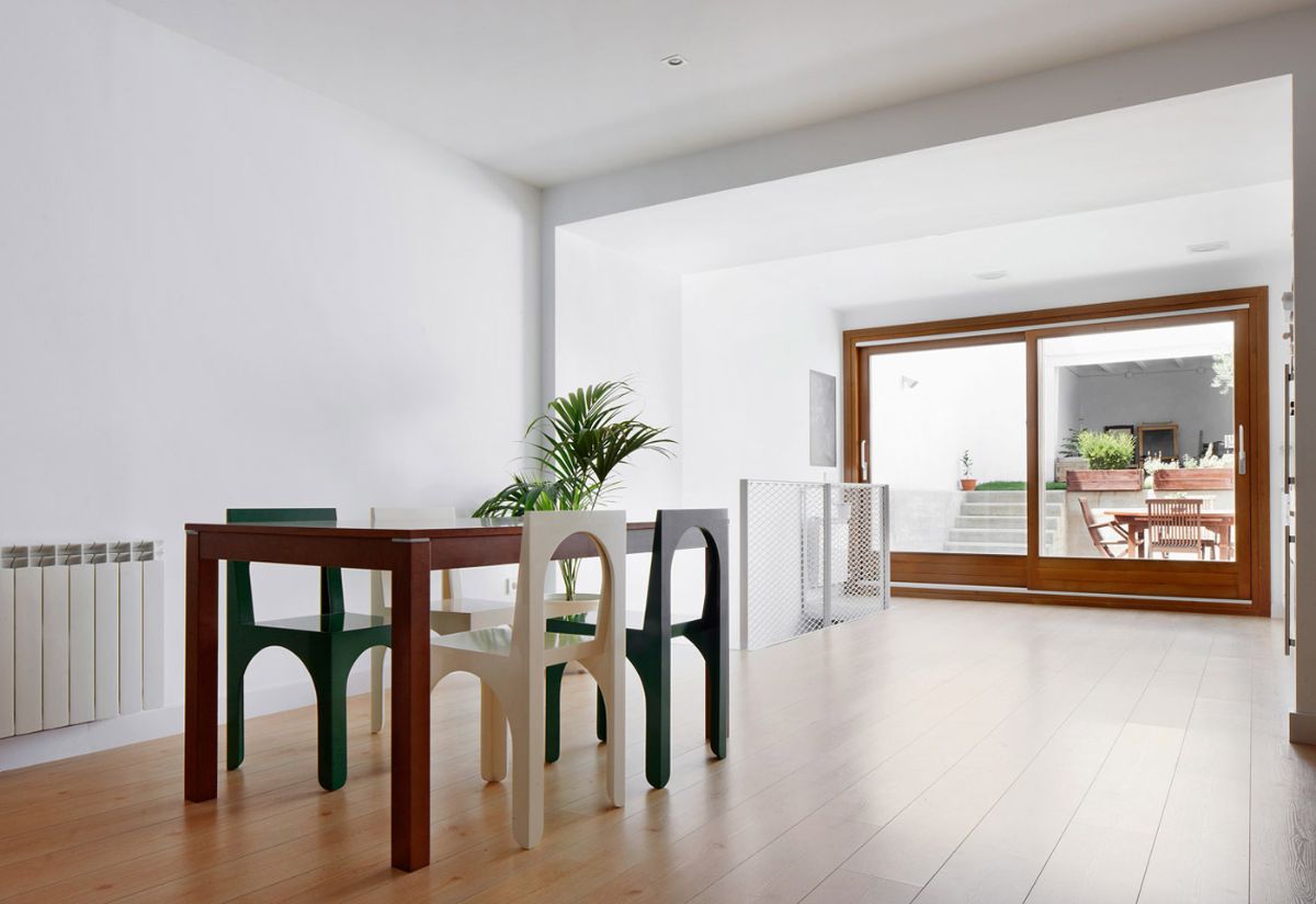 Because of the narrow space, a large opening was made for the living-dining room to bring more light as possible.