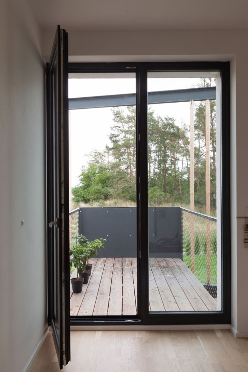 There is an exit door to the terrace from every room in the house, with a view of the surrounding trees.