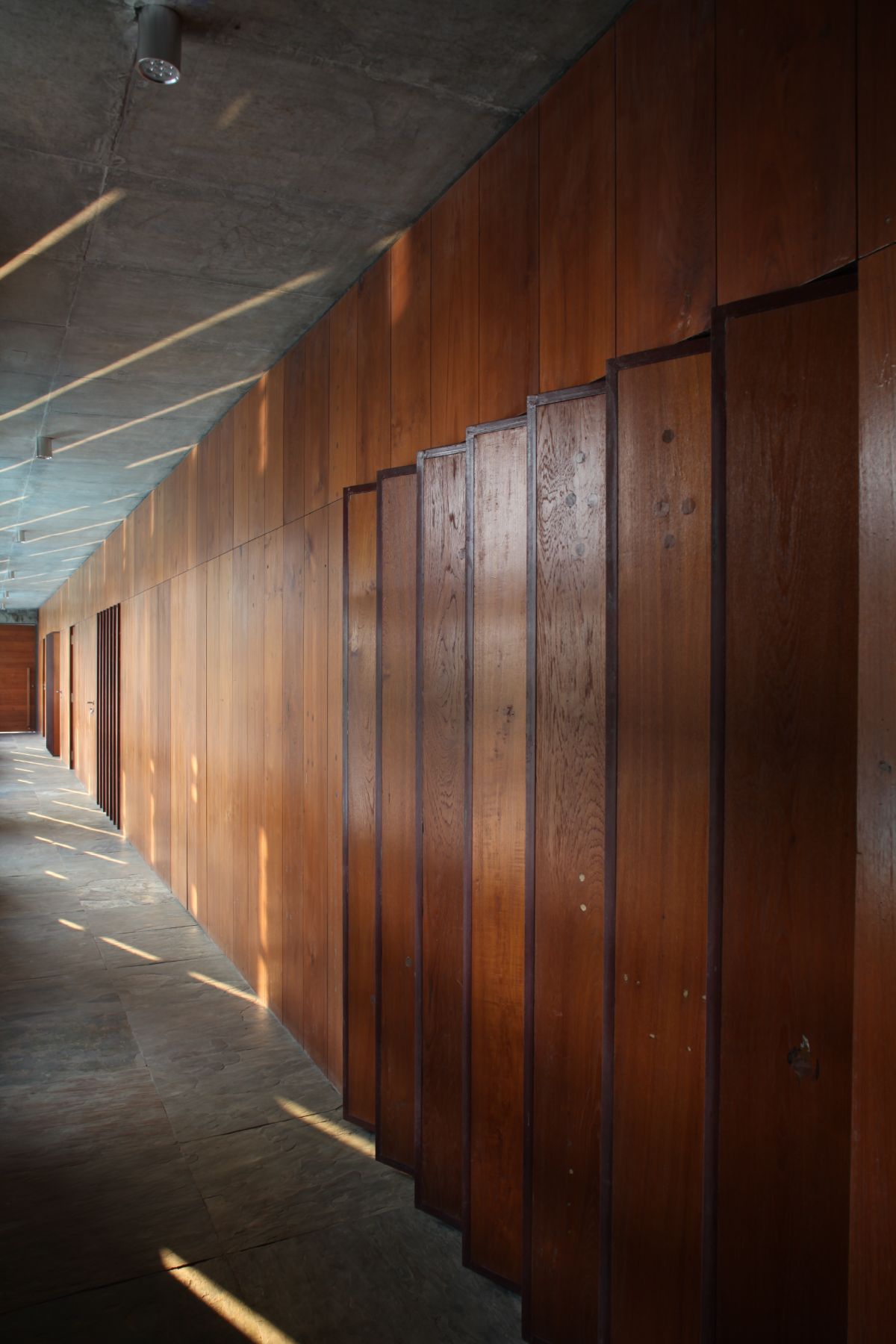 The floor is made of basalt stones and the wooden walls create a rustic atmosphere.