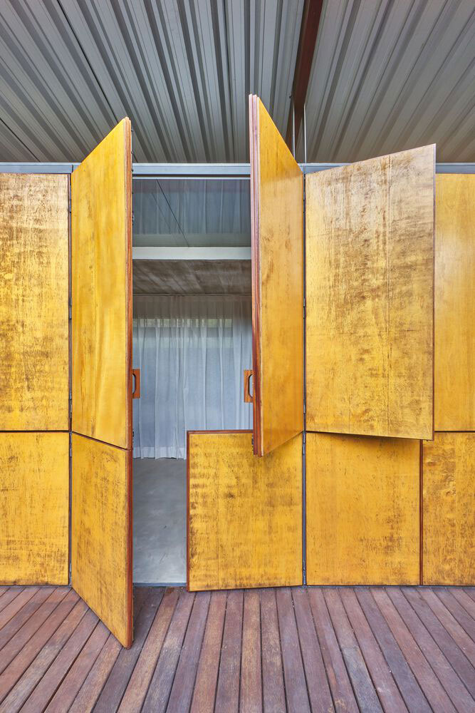 Exposed concrete finish is used as flooring inside the house.