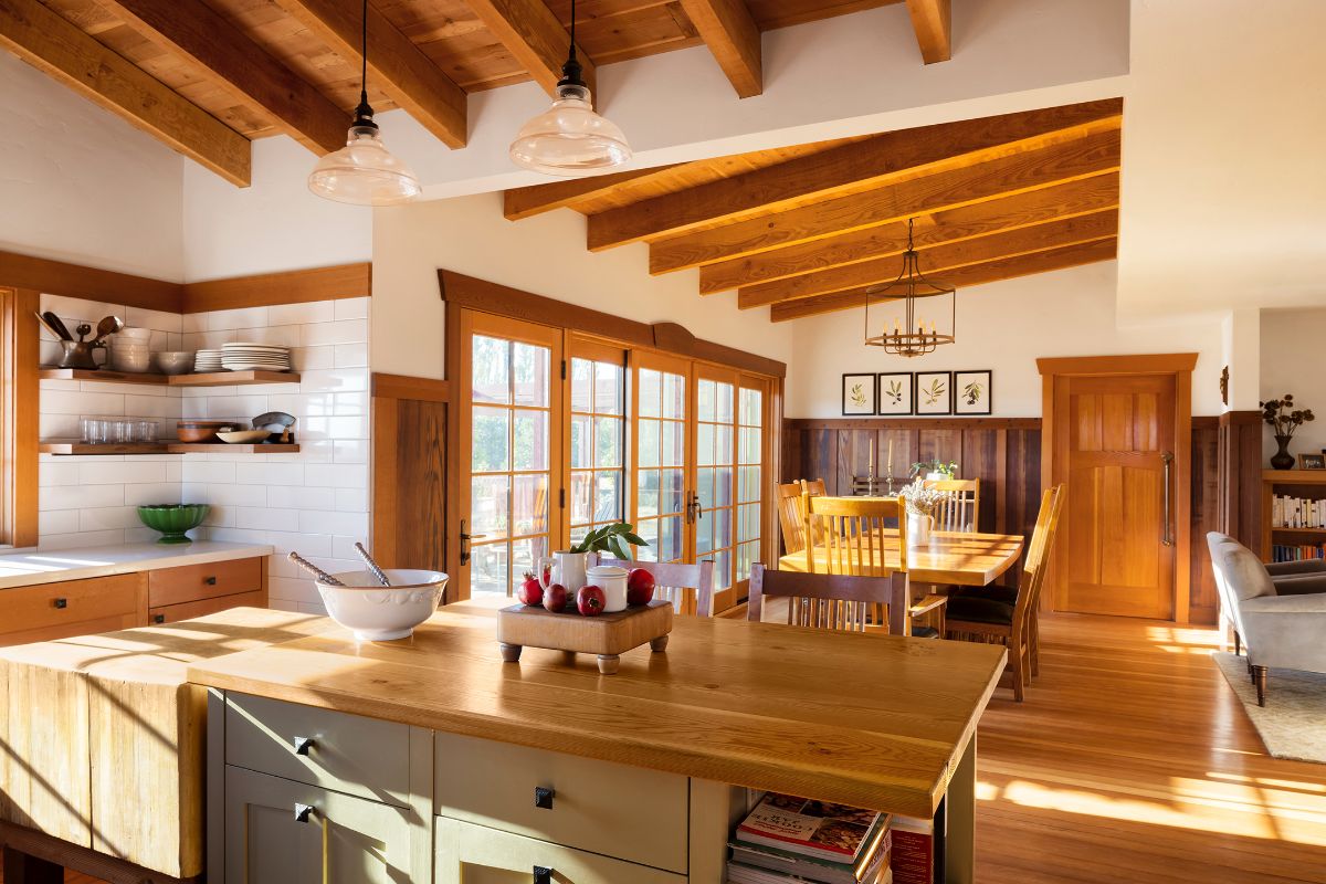 The kitchen next to the dining area features a kitchen island.