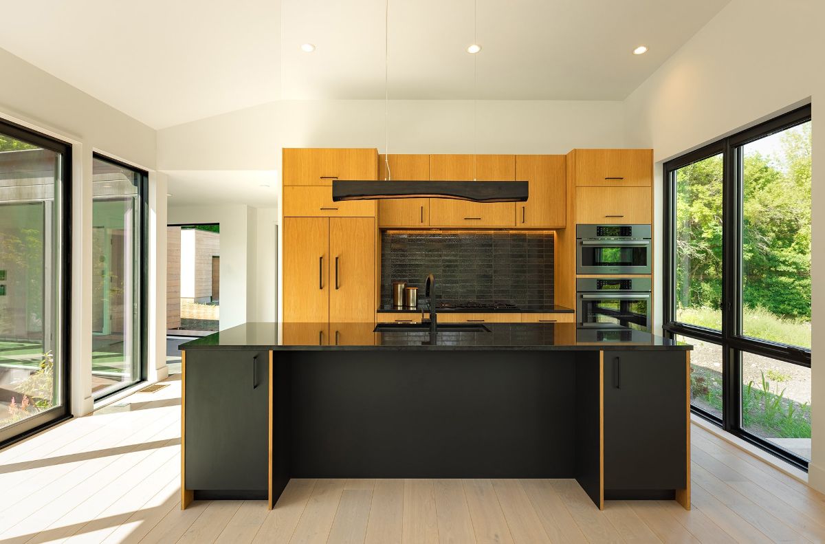 The kitchen features a kitchen island with a granite countertop.