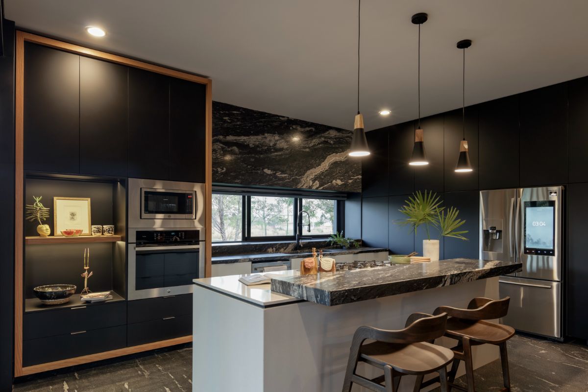 The kitchen features a bi-level kitchen island with a thick marble countertop.