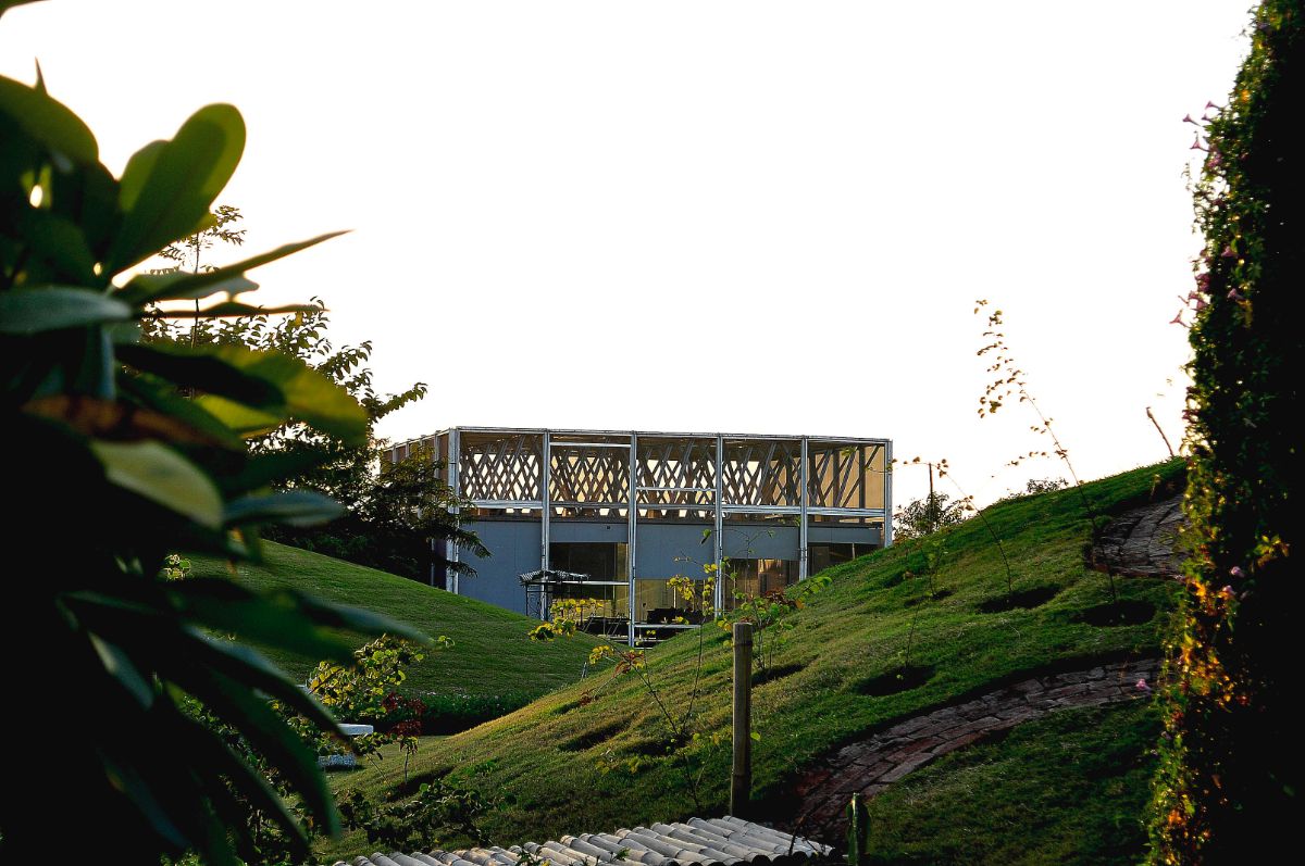 View of the net house through the surrounding foliage.