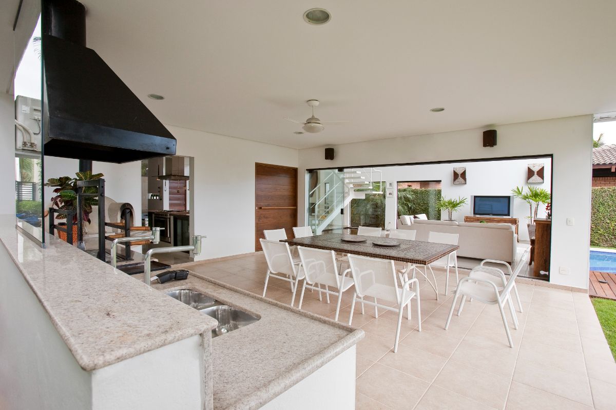 The dining area beside the kitchen has access outdoors.