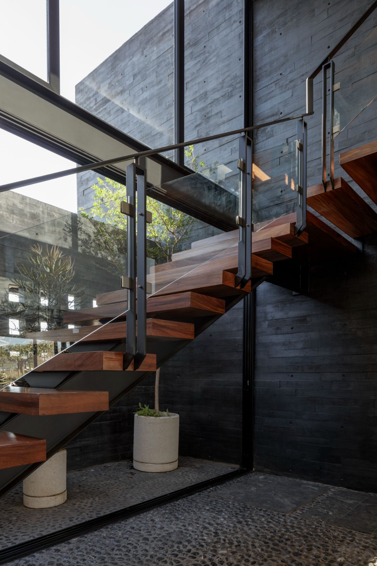 The staircase features solid wood steps supported by metal frames making a strong foundation.