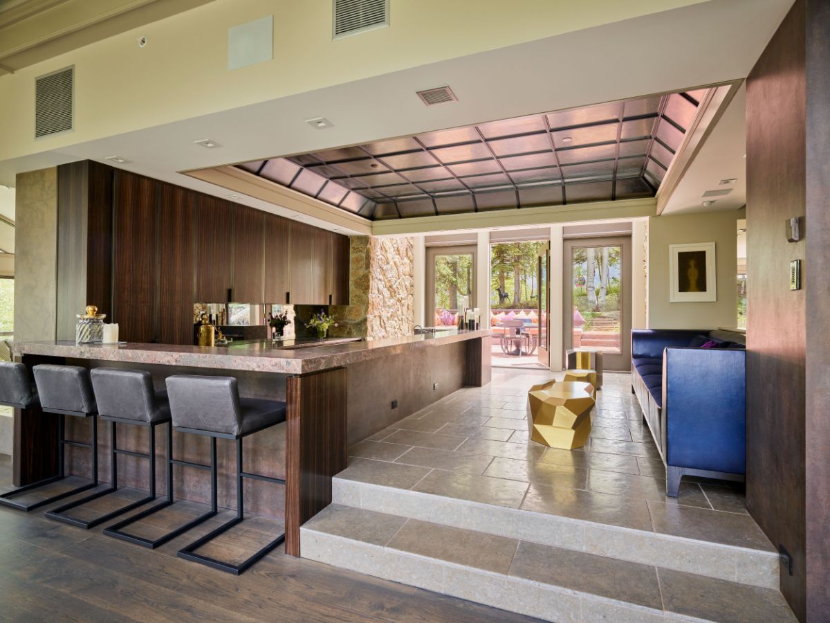 The bar area, which has a glass door that leads to the expansive outdoor decks. Image courtesy of Toptenrealestatedeals.com