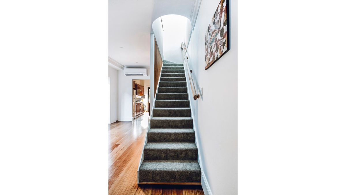 Through the upper floor, you can see the carpeted stairs in full view.