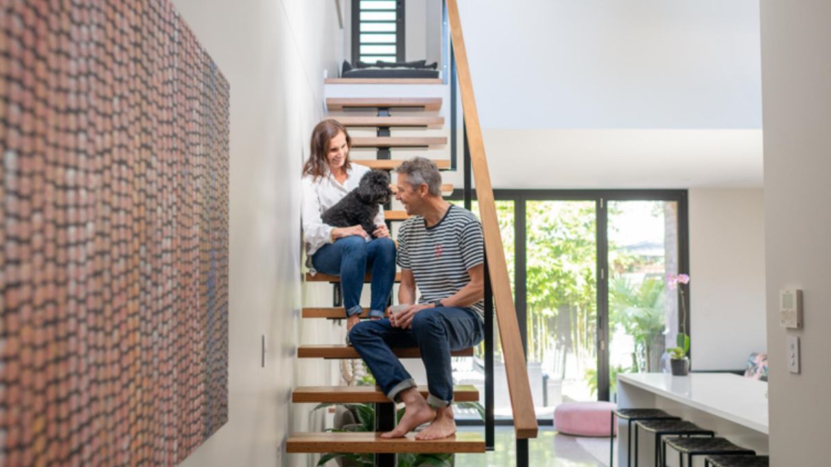 The glass doors that go to the outside are visible from the front of the staircase.