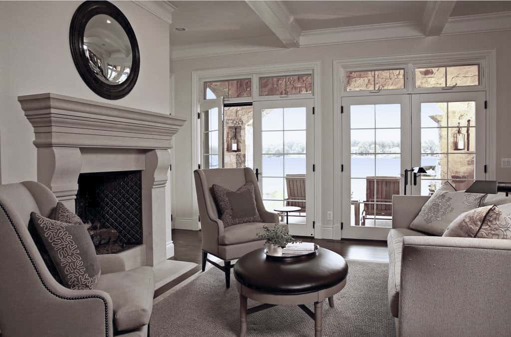 The living room includes stunning views of the nearby lake.