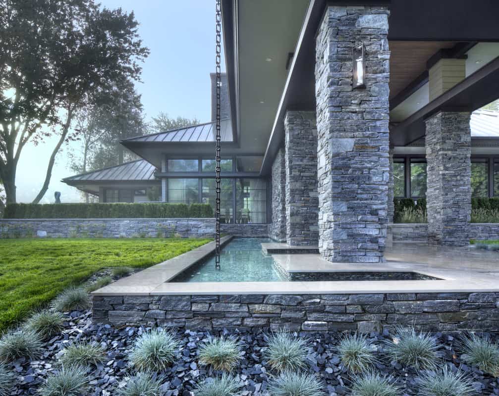 A reflecting pond that runs the covered walkway sets a nice feature to the house.