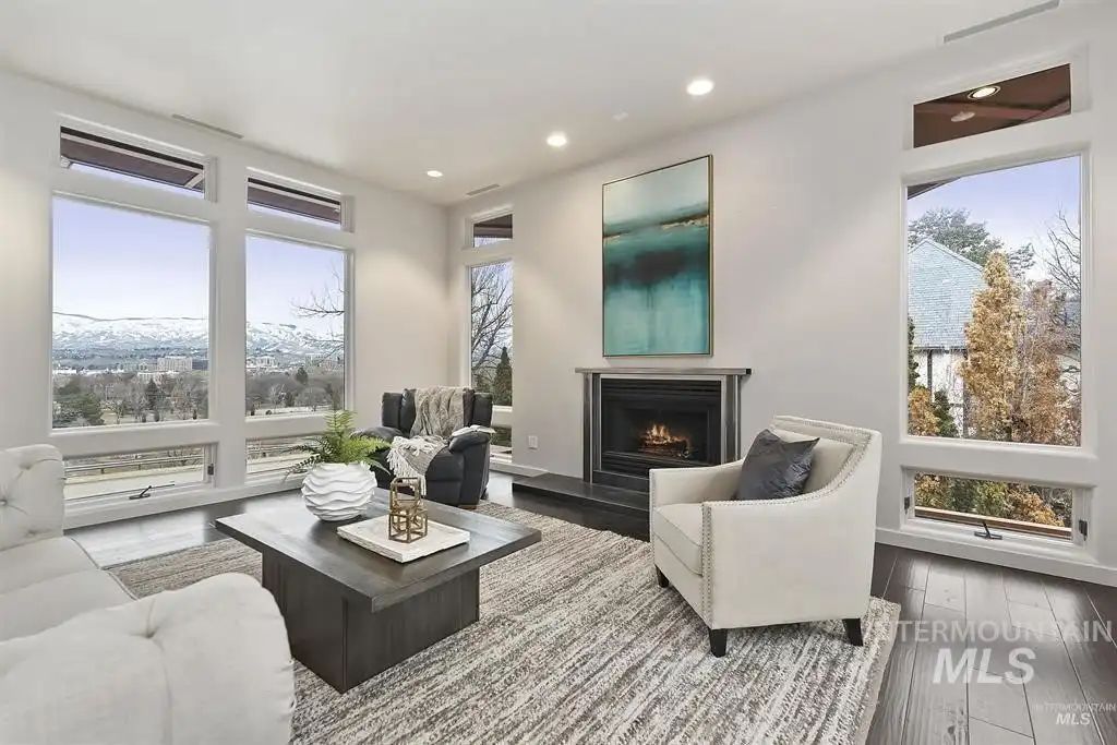 The master suite fireplace area has glass windows to showcase the outside view.