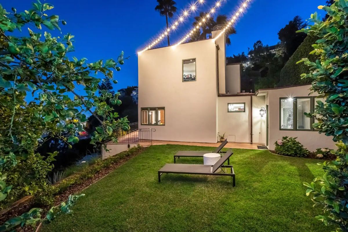 The sun loungers placed on the lawn are perfect for relaxation, and the place is lit with outdoor lights during the night.