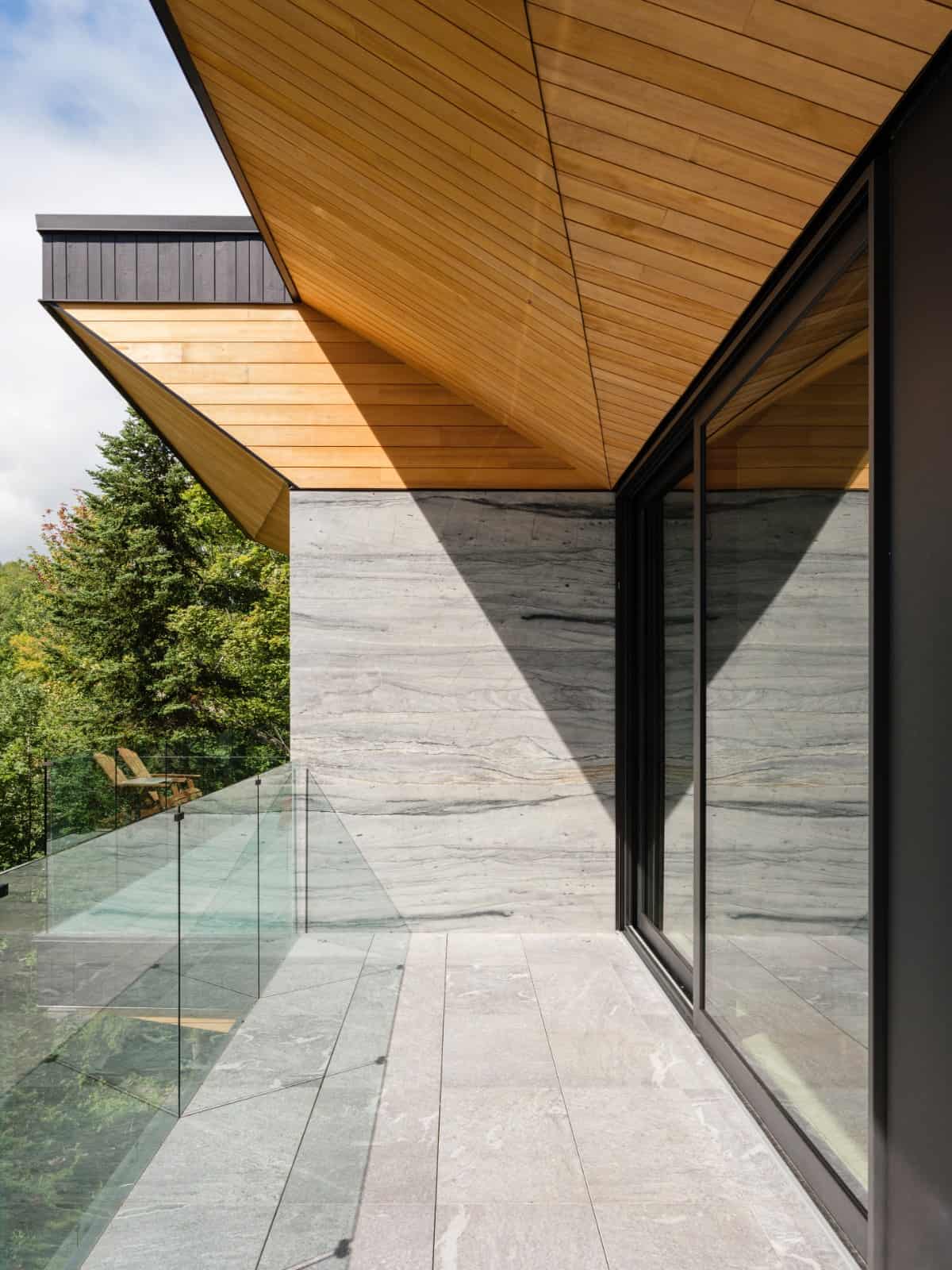 Oversized sliding glass doors extend the living space onto the balcony.