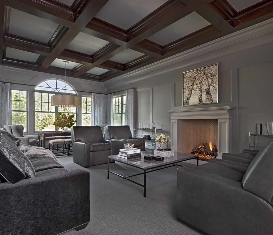 Full-height wainscoting and a wooden coffered ceiling add elegance to this living room.