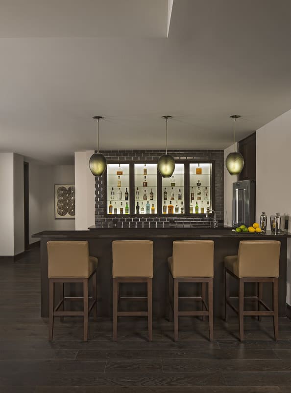 A wet bar enhances the entertaining on the lower level.