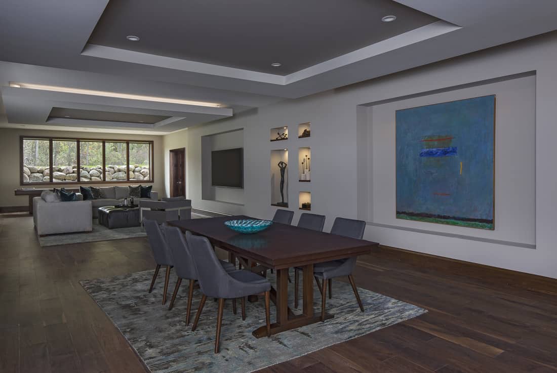 Tray ceilings define the open dining and living rooms in the basement.