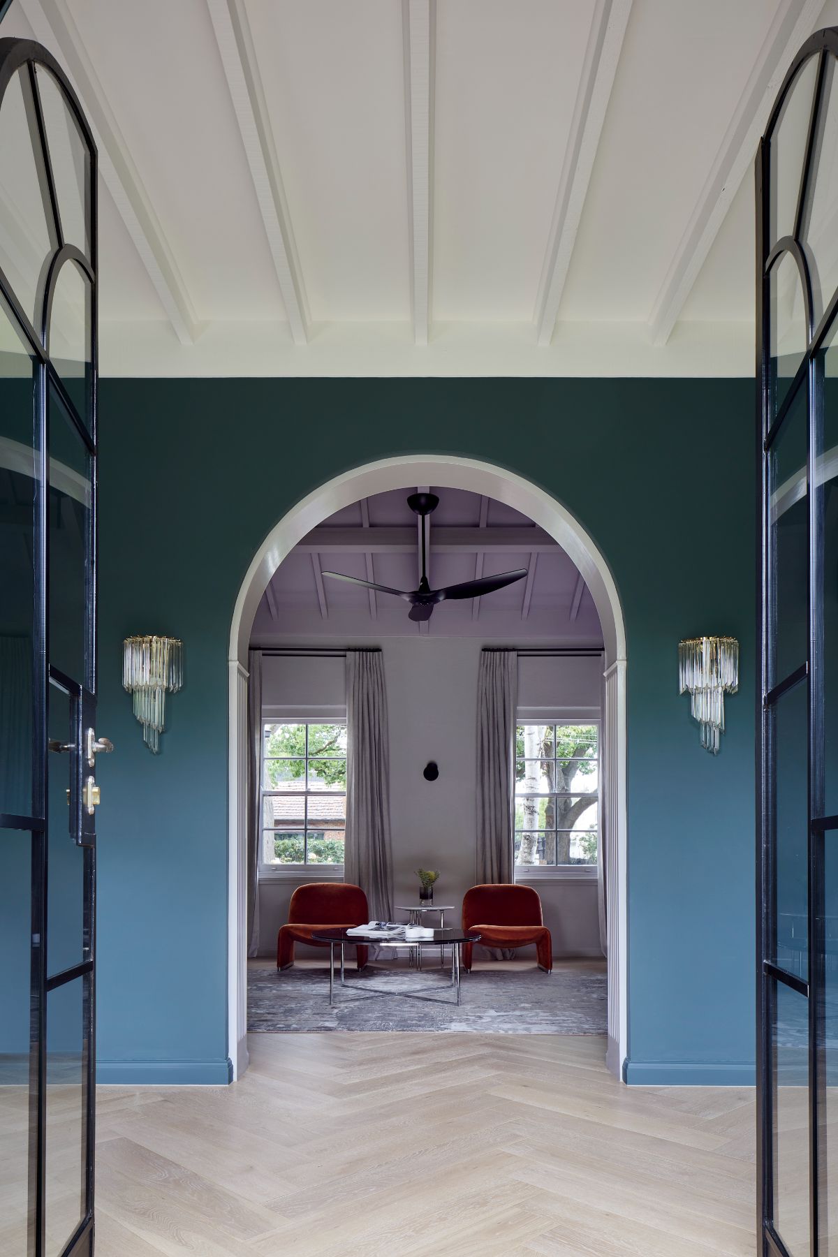 The house is inspired by a Spanish mission-style house, with its arched doorways.