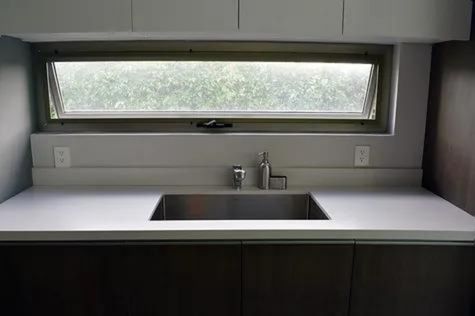 This photograph showcases the kitchen sink.