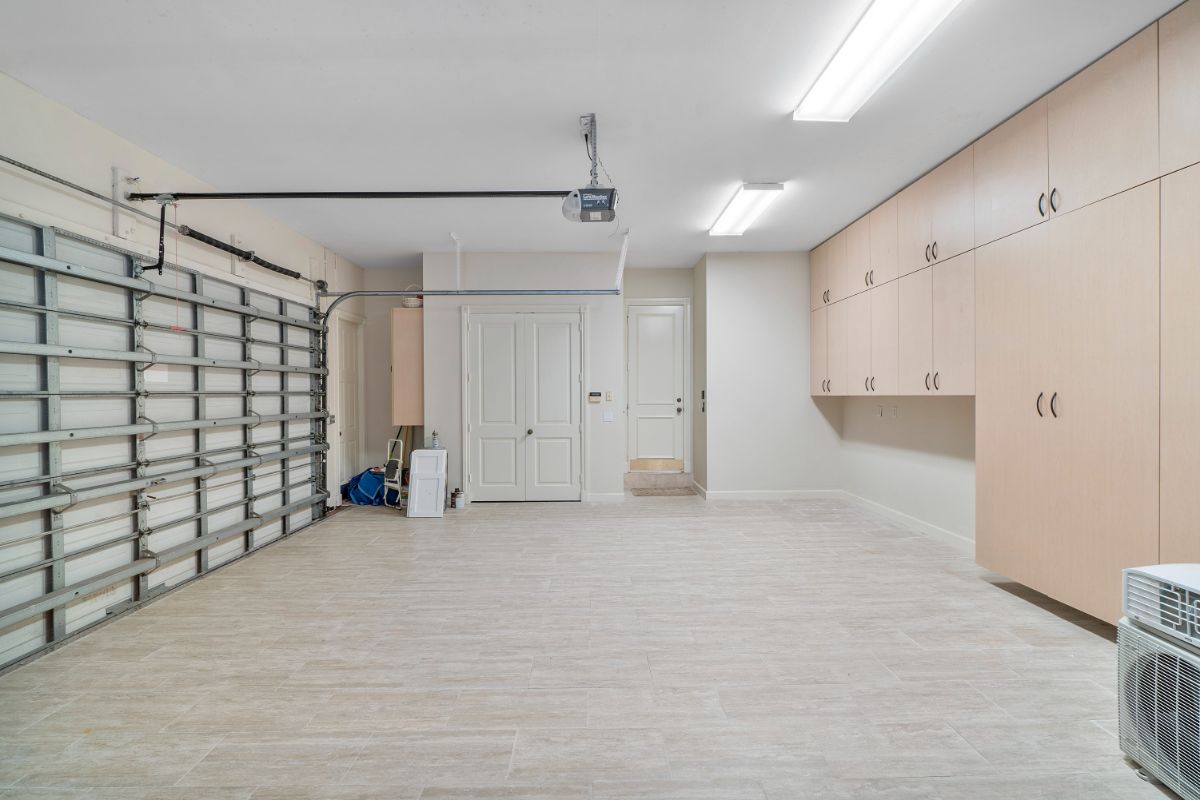 The garage features a cabinet for storage and a smart-home garage system.