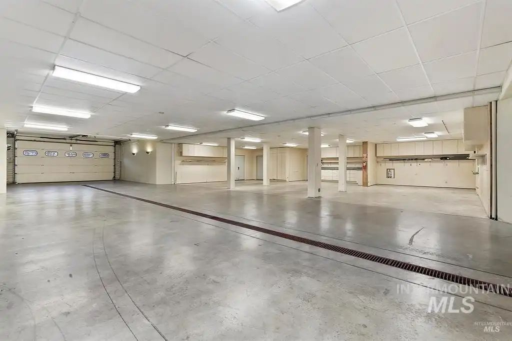 The garage in the basement can fit multiple cars at once.