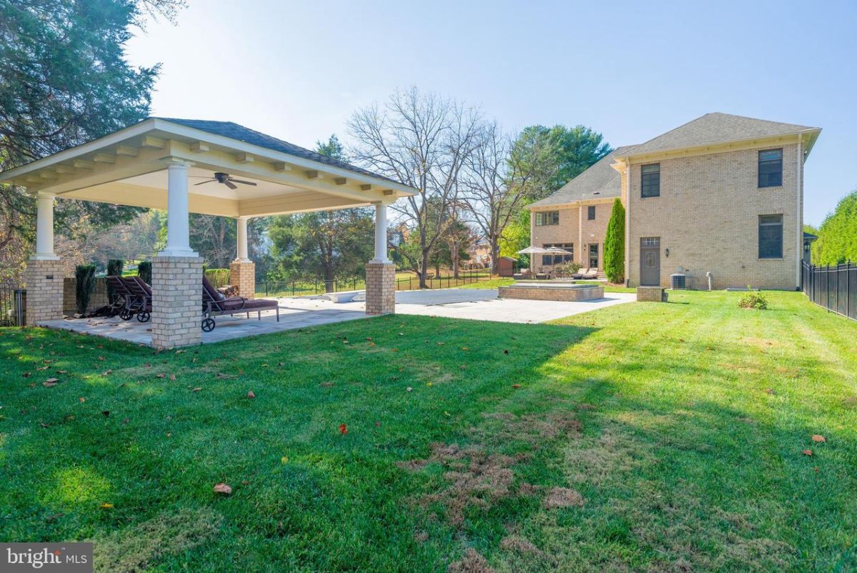 Outdoors is a covered patio with sun loungers for relaxation.