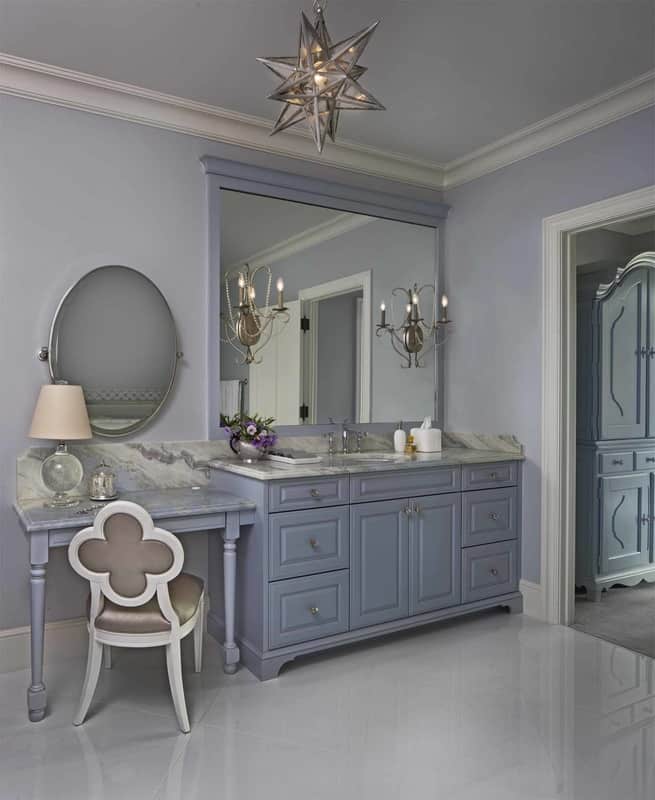 This bathroom features a gray vanity integrated with a makeup counter.