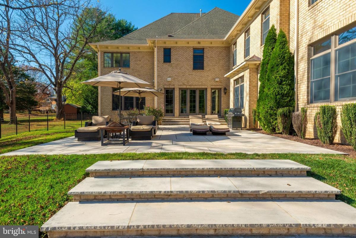 The outdoor patio features concrete slabs used for flooring and steps.