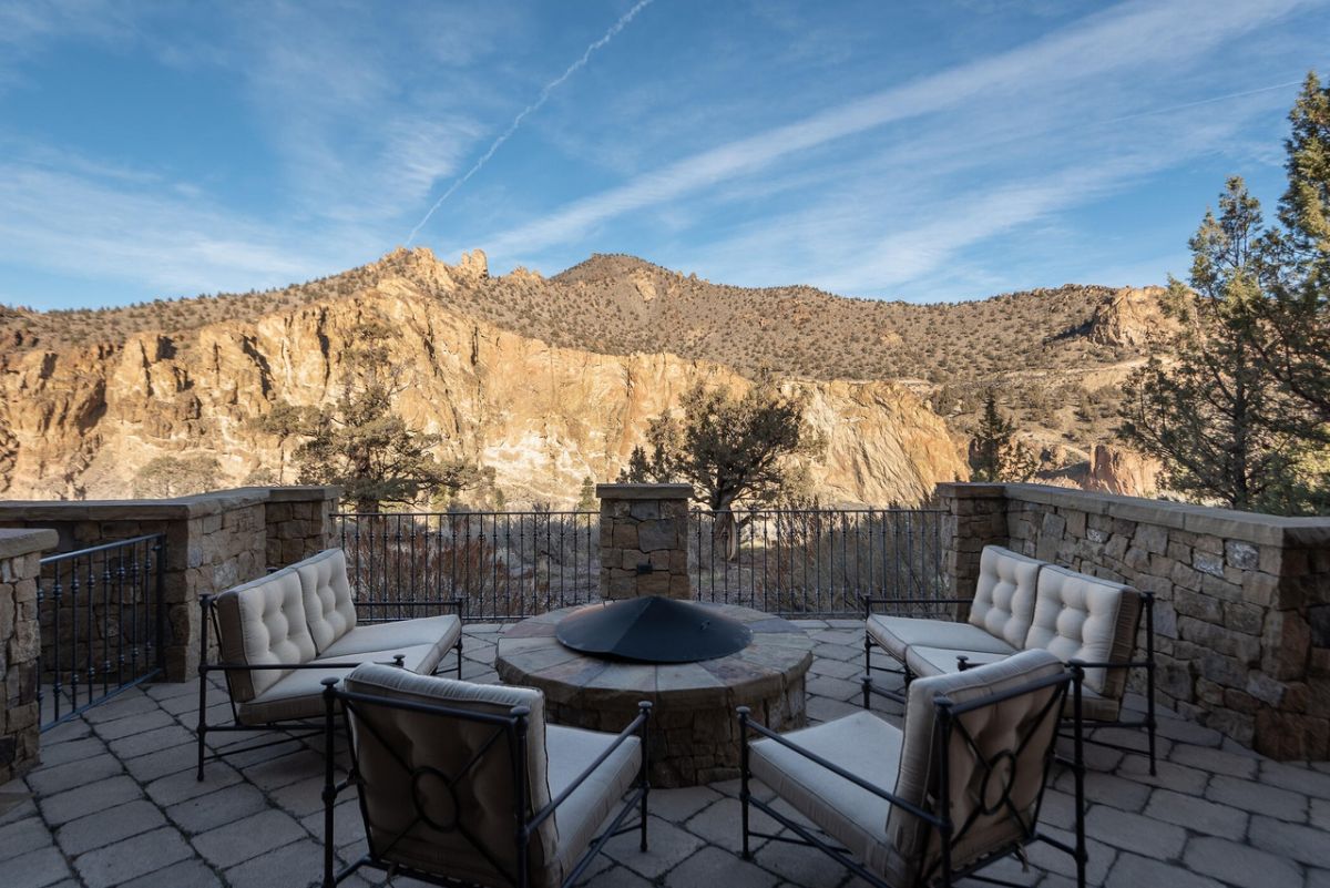 The patio features an outdoor fireplace that is perfect for relaxation while watching the view of the great mountain.