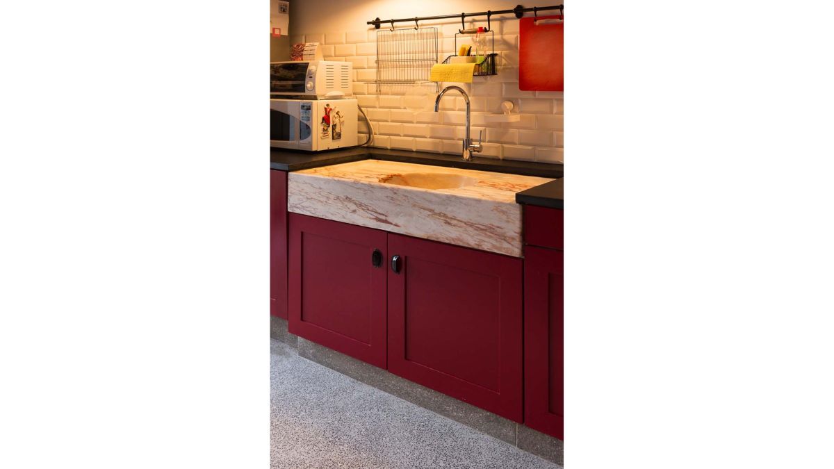 The kitchen sink includes adorable cabinetry and a sink with all the necessary equipment.