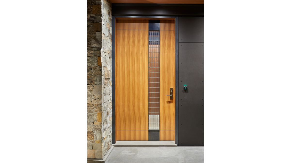 A closer look at the attractive, well-constructed wooden entrance door.